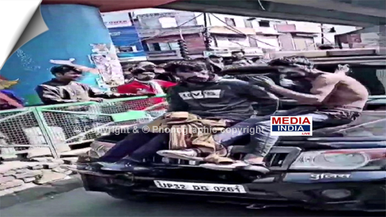 Two youths shot video sitting on the bonnet of a police car in Moradabad, UP, case registered